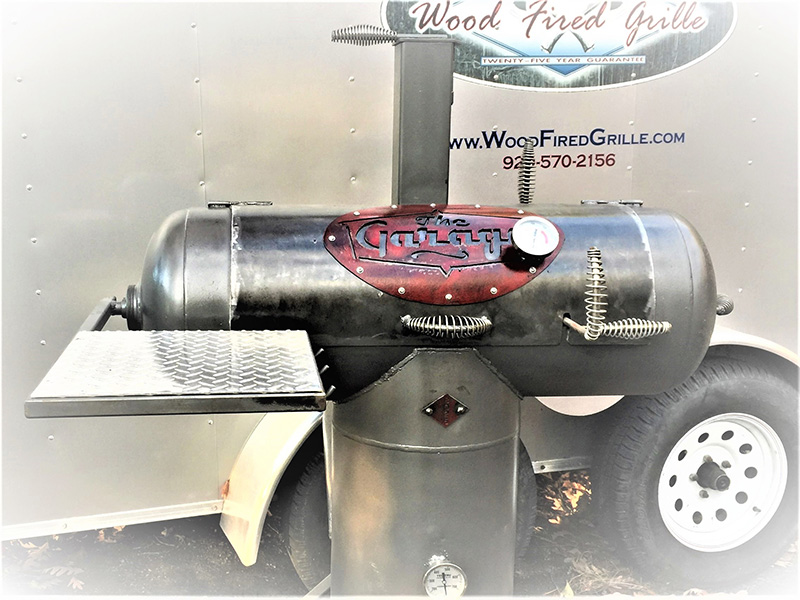 Silver grill with red cover art saying The Garage.