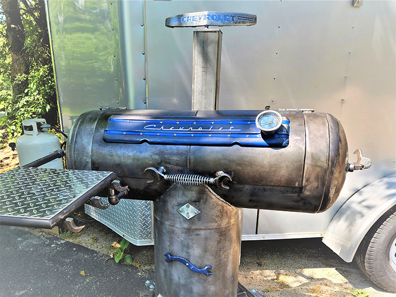 T-shaped black grill with blue & silver Chevrolet signature artwork