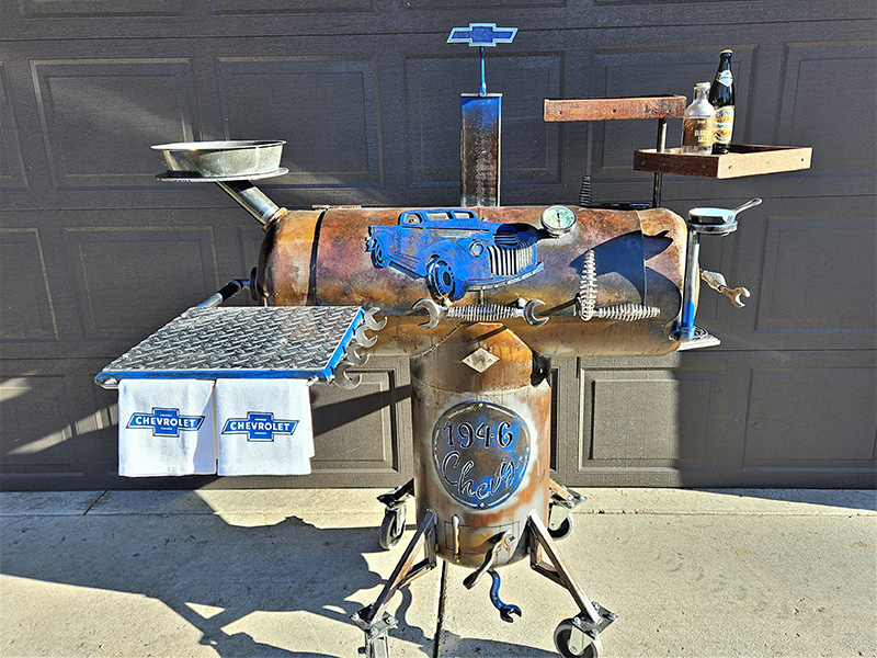 Rust-colored T-shaped grill with diamond pattern shelf in from and pickup truck artwork on cover