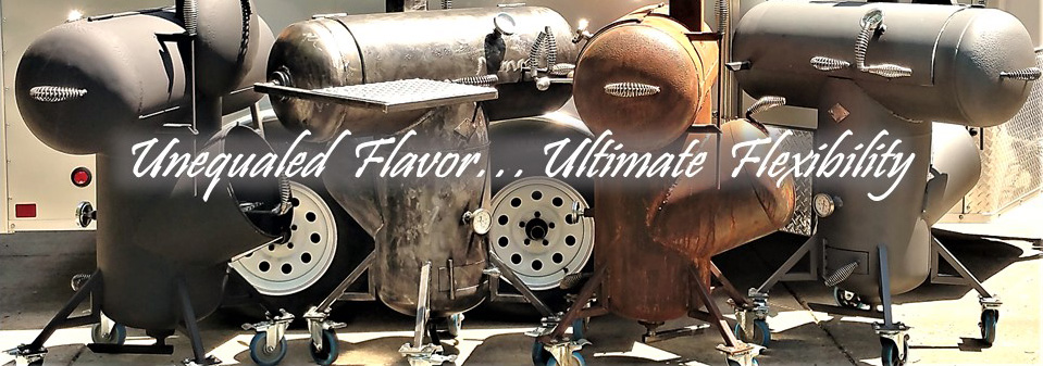 Four T-shaped grills. Left to right metallic charcoal-color, gunmetal-color, rust-color, metallic charcoal-color. All have coiled-wire handles, upper & lower temperature gages, and four legs with large caster wheels. Background white metal utility trailer.