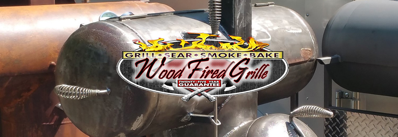 Black T-shaped grill with metal artwork