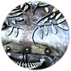 Close-up of gun metal colored grill cover with tree artwork