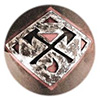 Close-up of a diamond-shaped metal plaque with two crossed wood axes cut out of the middle.